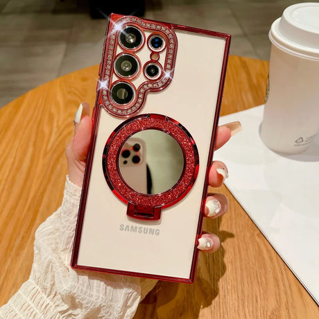 A woman holding a phone case with a red glitter case