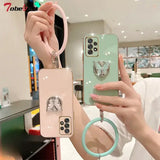 A woman holding a phone case with a ring
