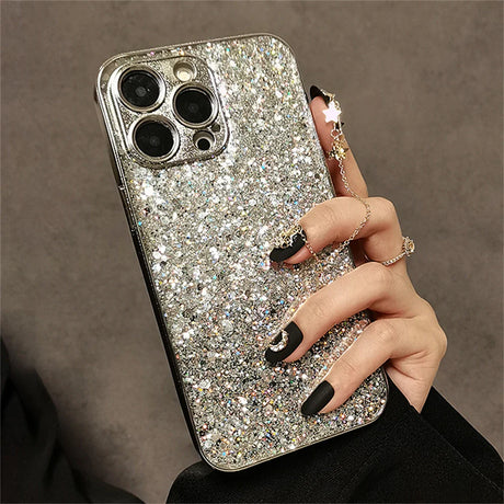 a woman holding a phone case with a ring on it