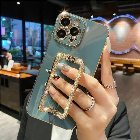 a woman holding a phone case with a ring on it