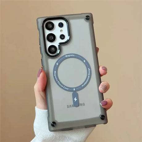 A woman holding a phone case with a ring on it