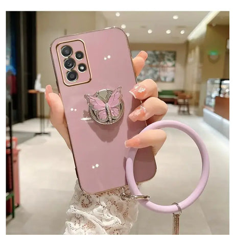 A woman holding a phone case with a ring