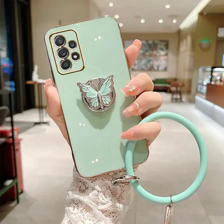 A woman holding a phone case with a ring