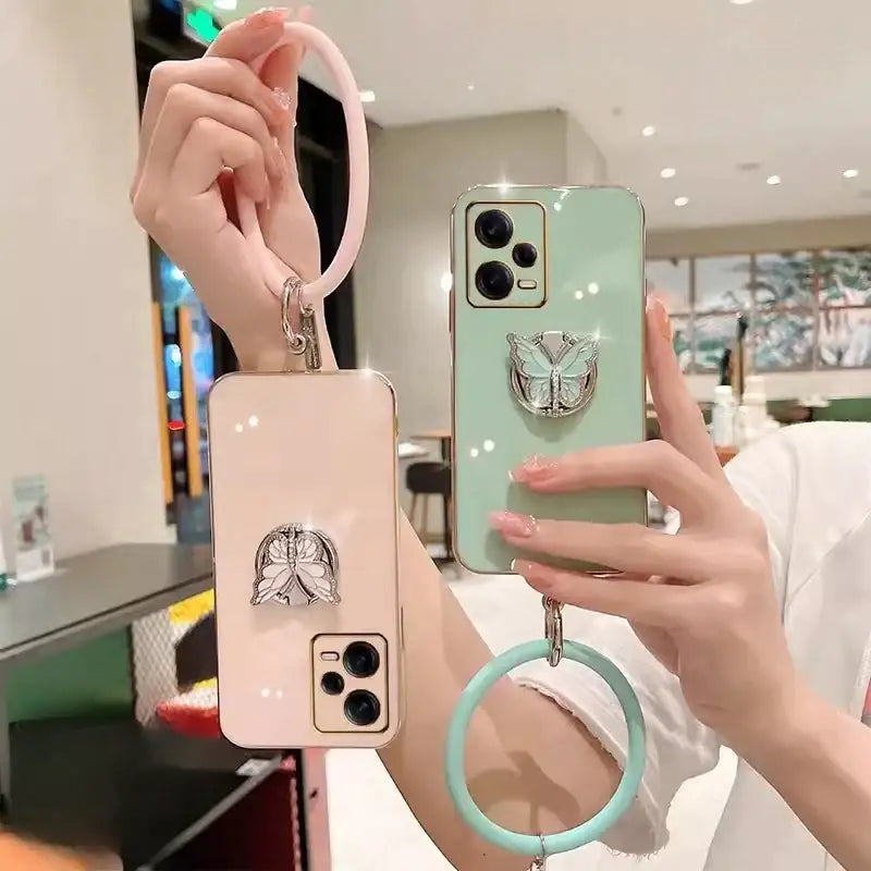 A woman holding a phone case with a ring