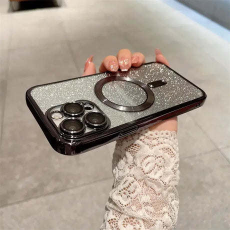 A woman holding a phone case with a ring holder