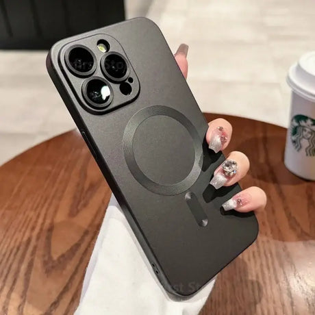 a woman holding a phone case with a ring on it