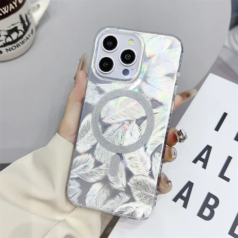 a woman holding a phone case with a silver foil effect
