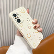 a woman holding a phone case with a smiley face on it