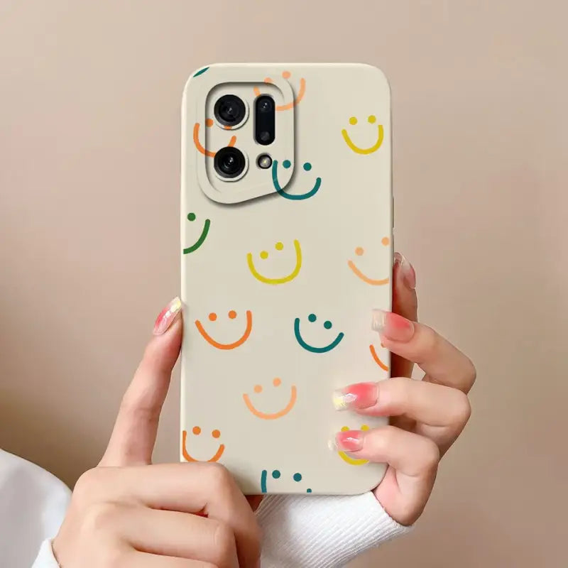a woman holding a phone case with a smiley face pattern