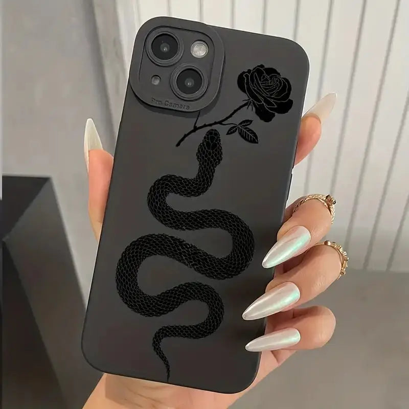 a woman holding a phone case with a snake on it