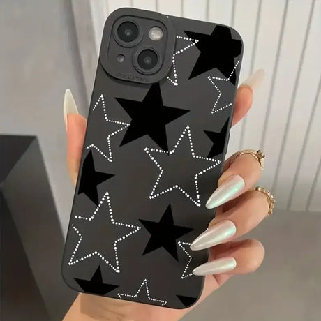 A woman holding a phone case with stars on it