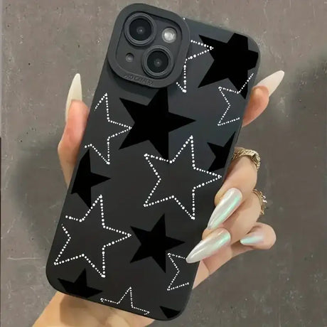 A woman holding a phone case with stars on it