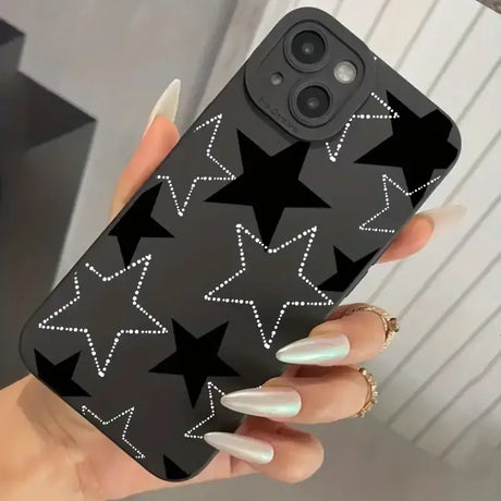 A woman holding a phone case with stars on it