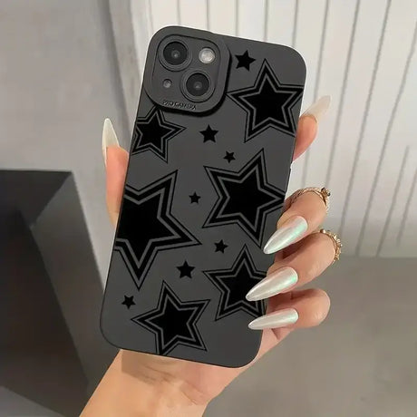 A woman holding a phone case with stars on it