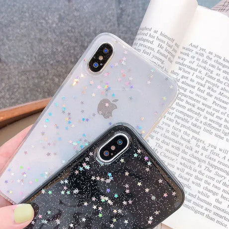 A woman holding a phone case with stars on it