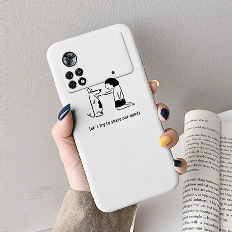 A woman holding a phone case with the text let the dog