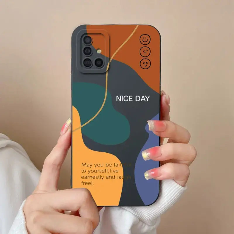 a woman holding up a phone case with the text nice day
