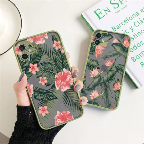 A woman holding a phone case with a tropical print