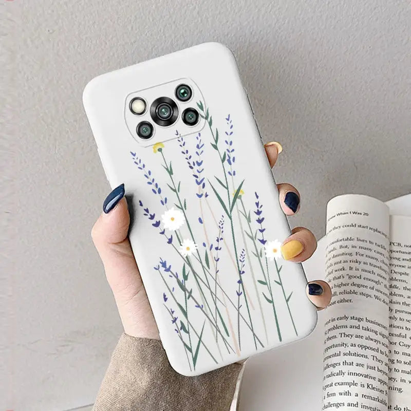 a woman holding a phone case with a watercolor painting of lavender flowers