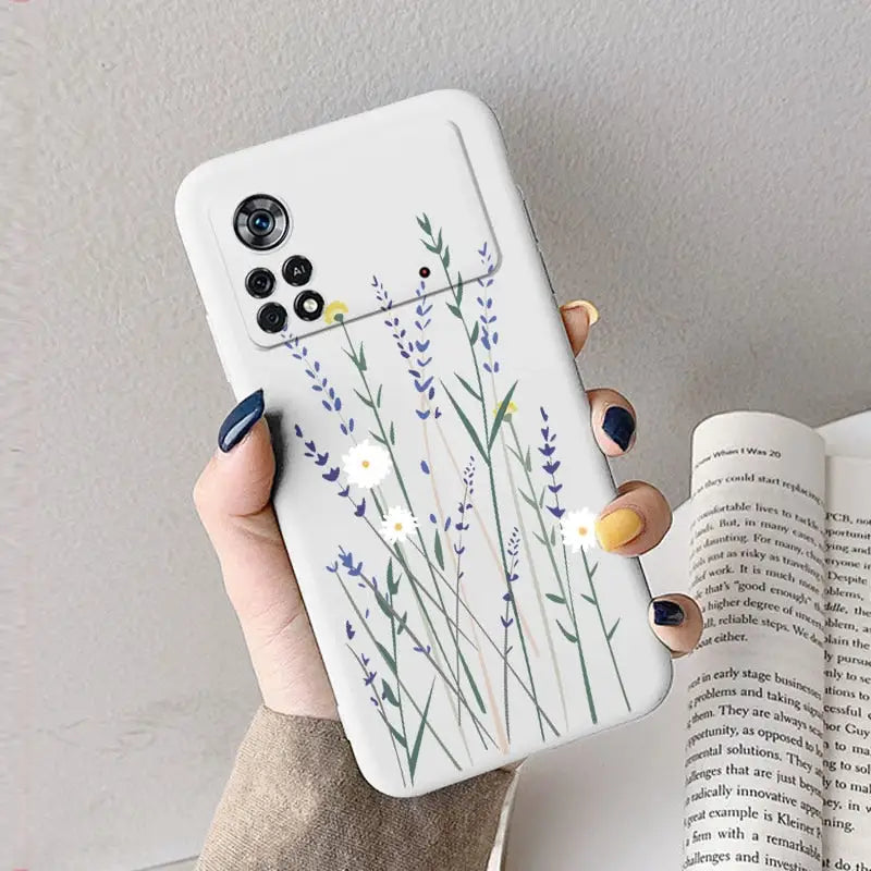 a woman holding a phone case with a watercolor painting of lavender flowers