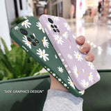 a woman holding a phone case with white flowers on it