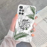 a woman holding a phone case with the words good vibe on it