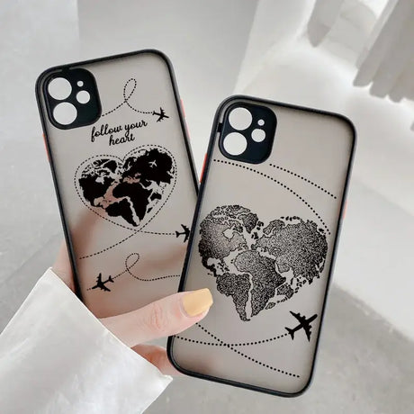 A woman holding a phone case with a world map on it