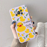 a woman holding a phone case with yellow ducks on it