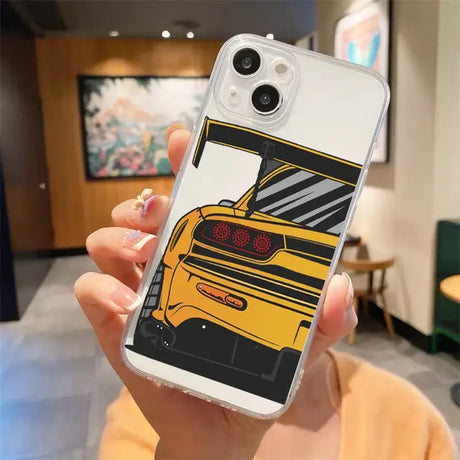 A woman holding a phone case with a yellow car