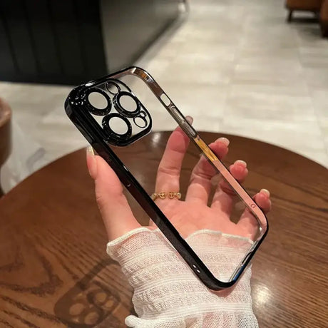 A woman holding a phone with a cigarette in her hand