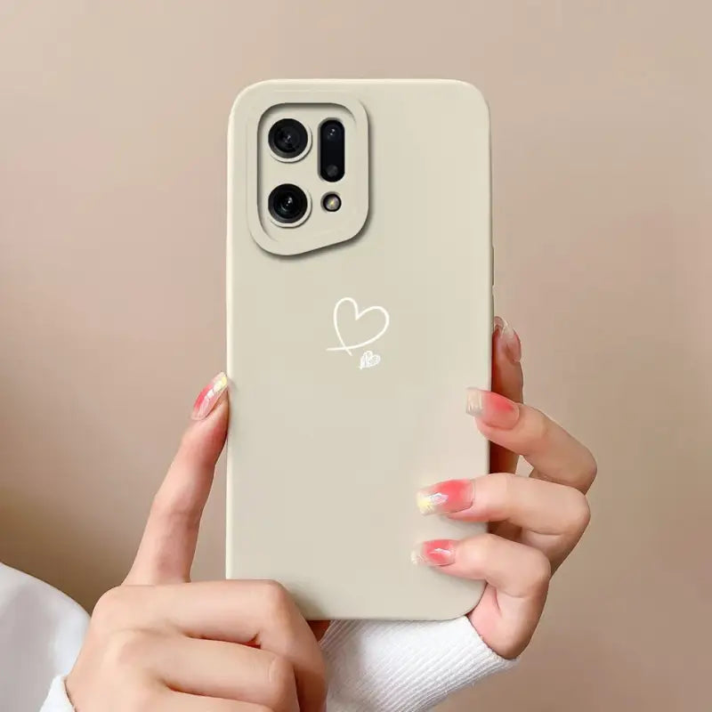 A woman holding a phone with a heart on it