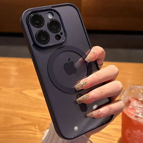 A woman holding a phone with a ring on it