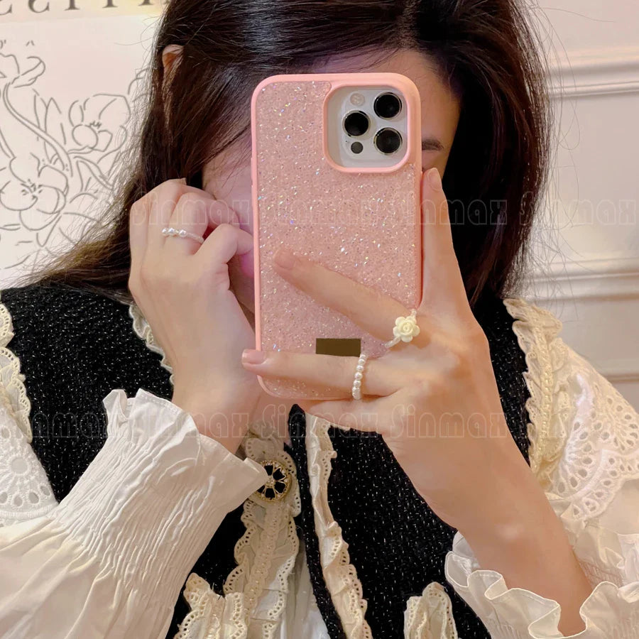 woman taking a picture of herself with her phone in a mirror