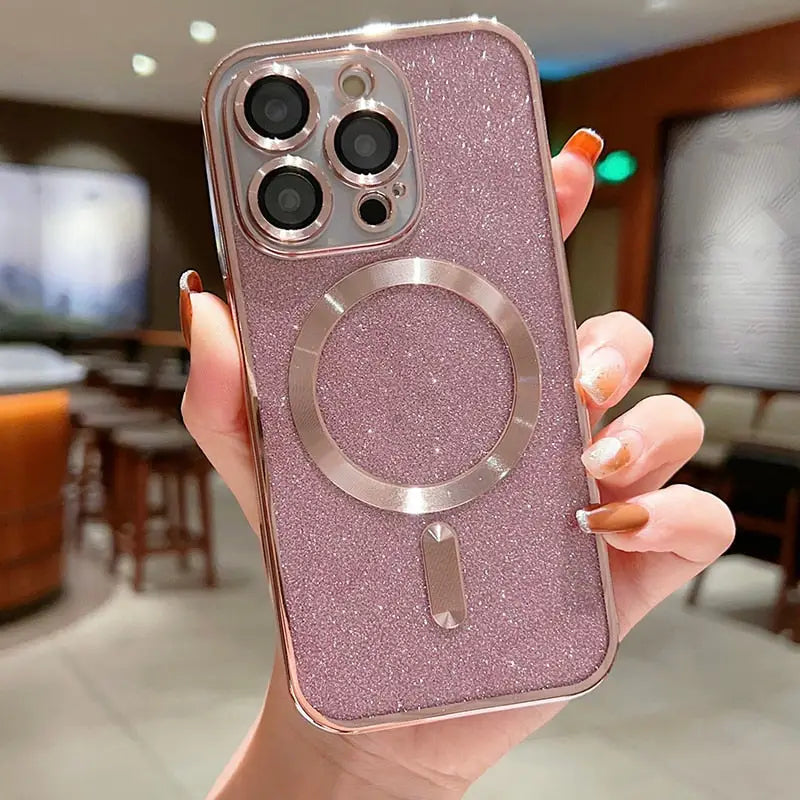 A woman holding a pink glitter phone case