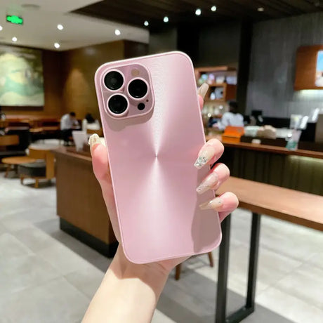 A woman holding up a pink iphone case