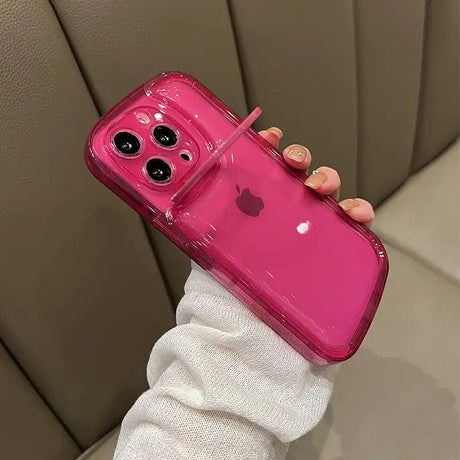 A woman holding a pink iphone case