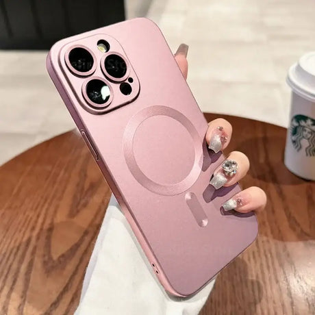 a woman holding a pink iphone case