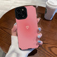 A woman holding a pink iphone case