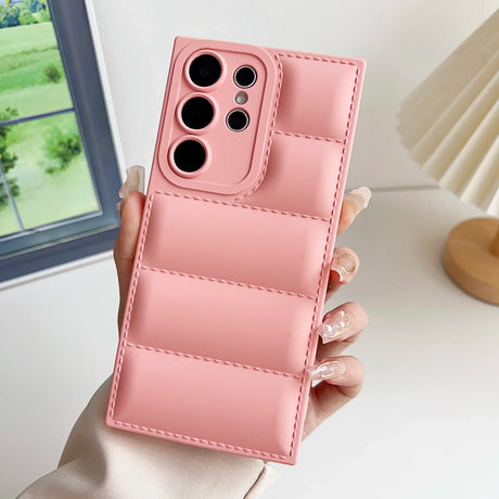 A woman holding a pink iphone case