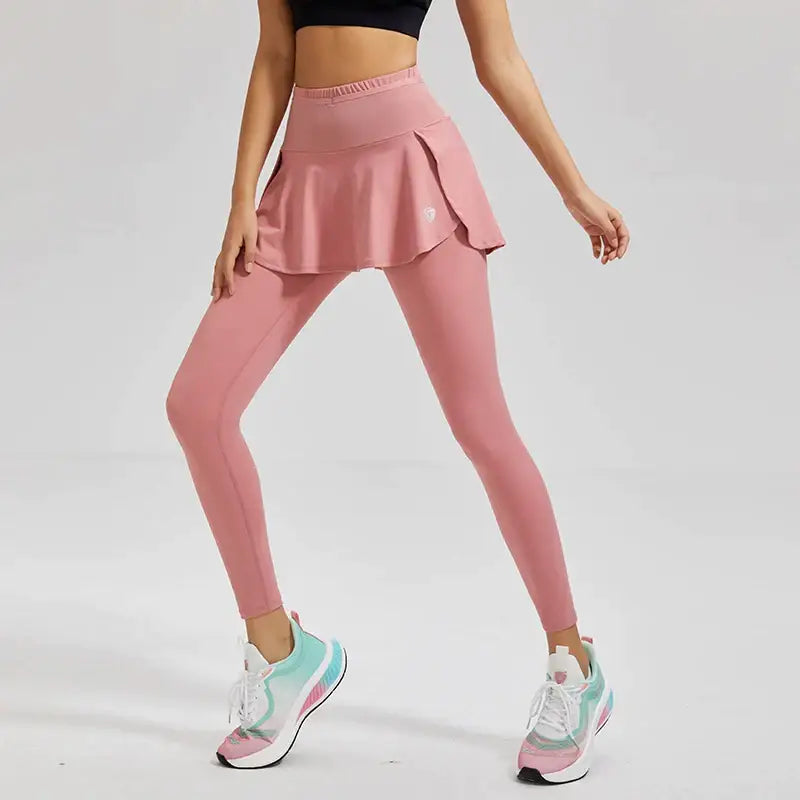 a woman in pink leggings and a black top