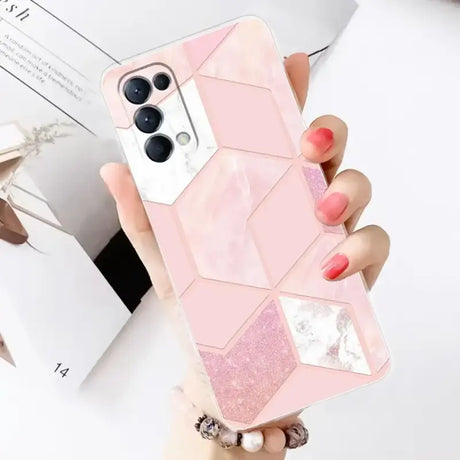 A woman holding a pink phone case with a white and pink marble pattern