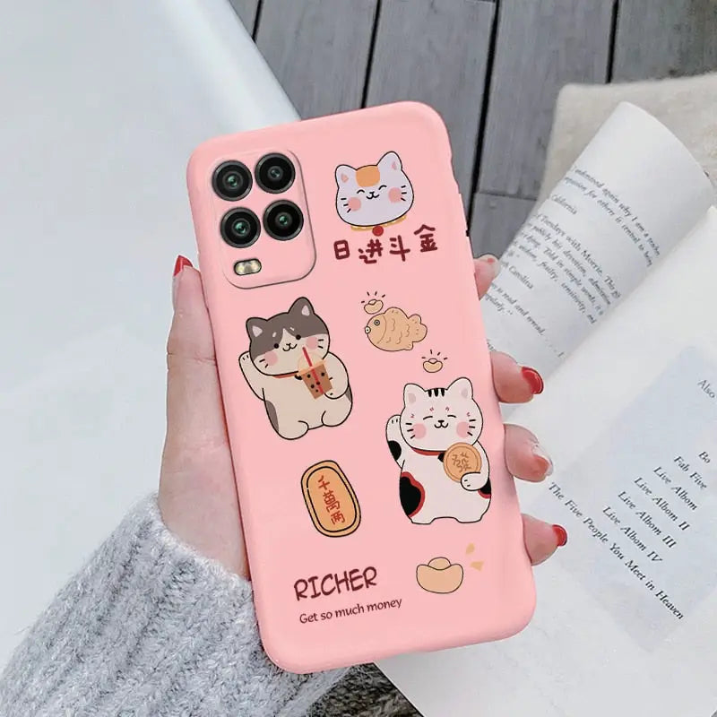 a woman holding a pink phone case with cartoon characters on it