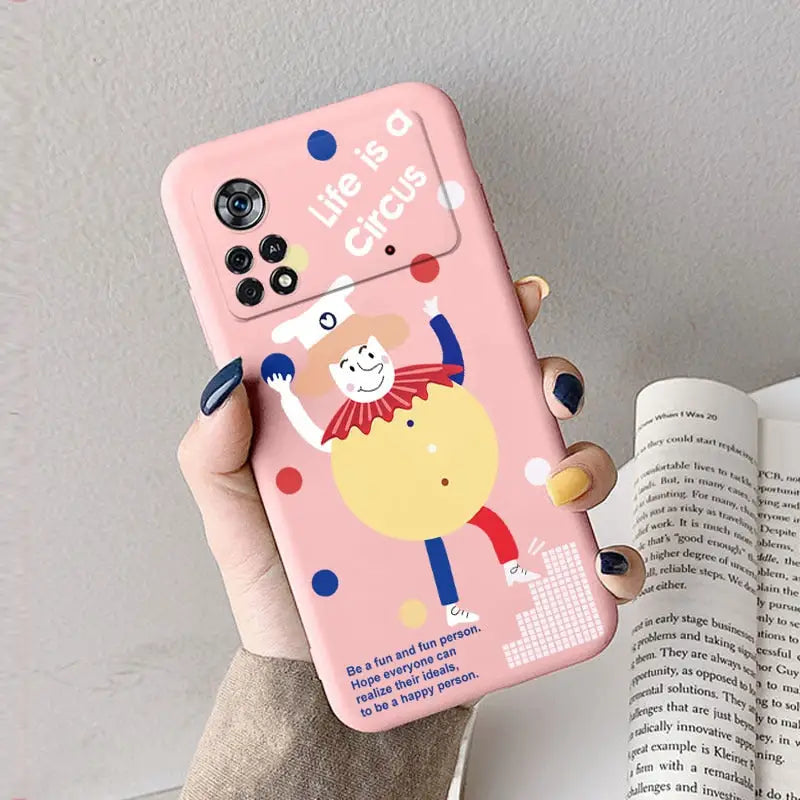 a woman holding a pink phone case with a cartoon character on it