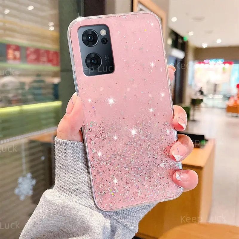a woman holding up a pink phone case