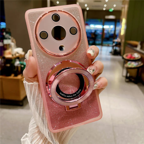 a woman holding a pink phone case with a ring
