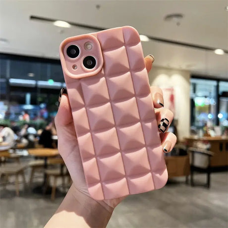 A woman holding a pink phone case