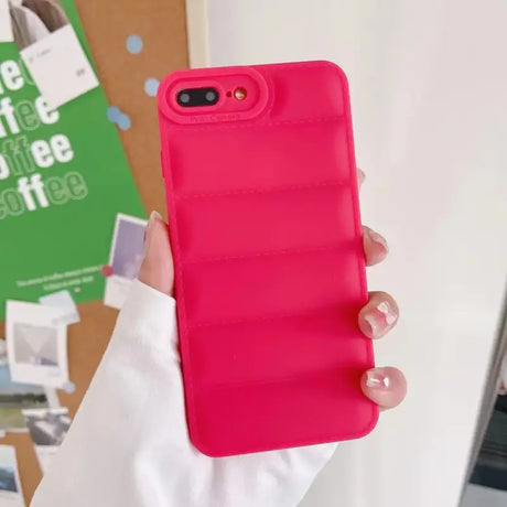 A woman holding a pink phone case