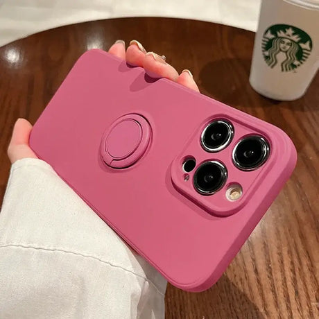 A woman holding a pink phone case