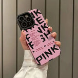 a woman holding a pink phone case with the words pink