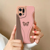 A woman holding a pink phone case with a butterfly on it